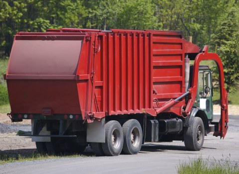 Crew preparing for a commercial waste collection in a service area